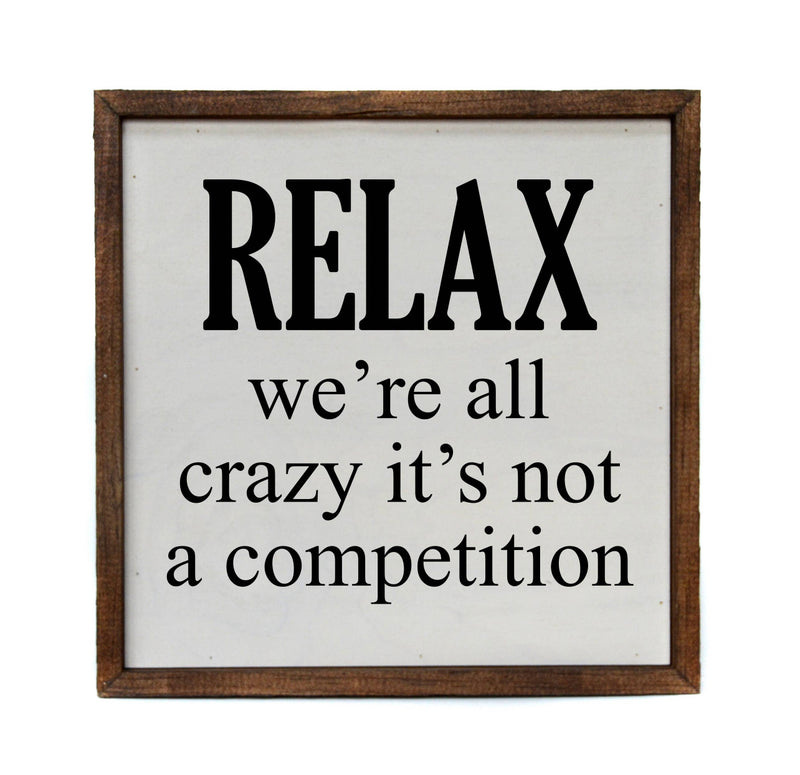 Relax we’re all crazy Wooden Sign